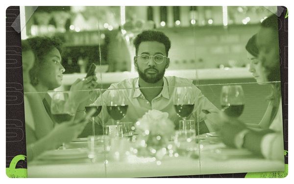 A man sitting at a dinner table looking annoyed
