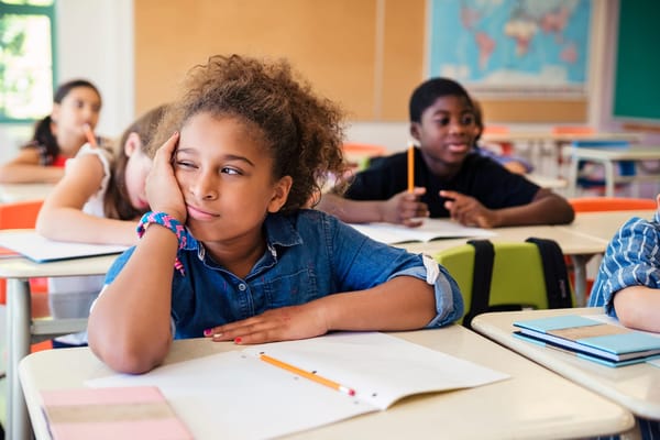 Young girl bored in class